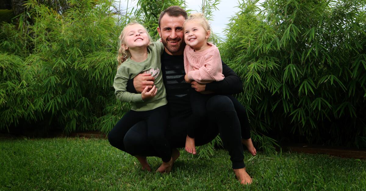 Alexander Volkanovski relaxes with his daughters Airlie and Ariana. Photo: Sylvia Liber