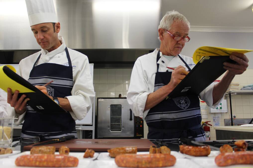 TASTE A WINNER: Bega TAFE commercial cookery teacher David Arens judges sausaged alongside his father and retired chef, Ulli Arens. Photo: Alana Beitz