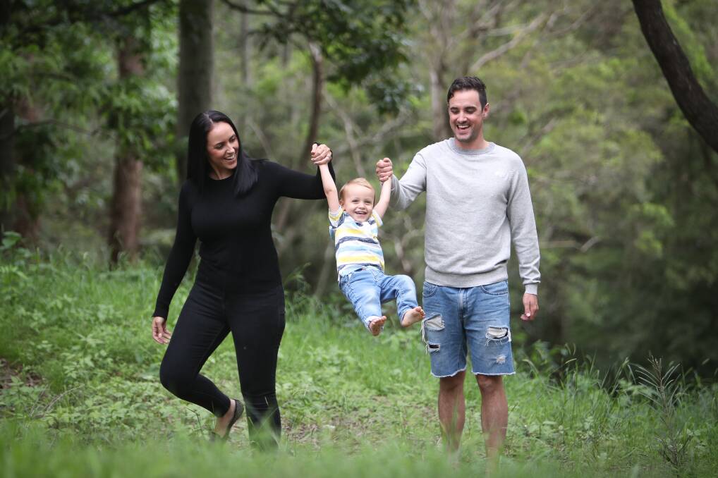 Selfless act: Nichola Pereira and Neal Byrne, with son Leo, have downsized their wedding and will donate $15,000 to bushfire victims. Picture: Adam McLean