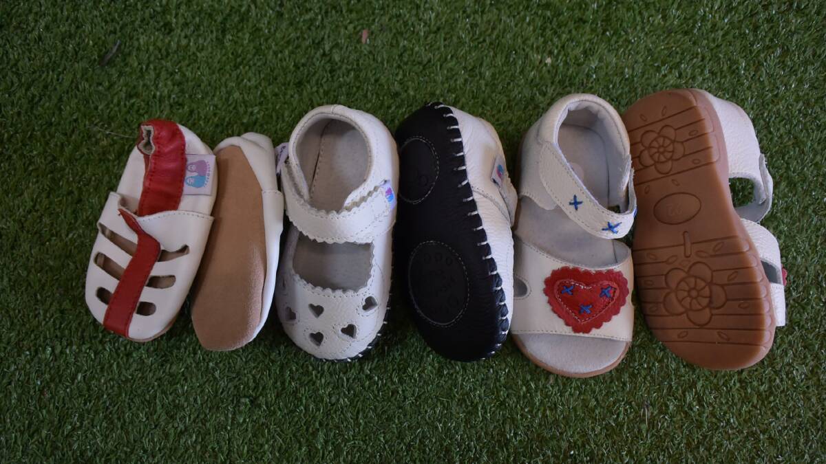 STAGES: A pair of Beautiful Soles' soft-soled baby shoes, a pair of inbetweenies and a pair of children's hard-soled shoes.