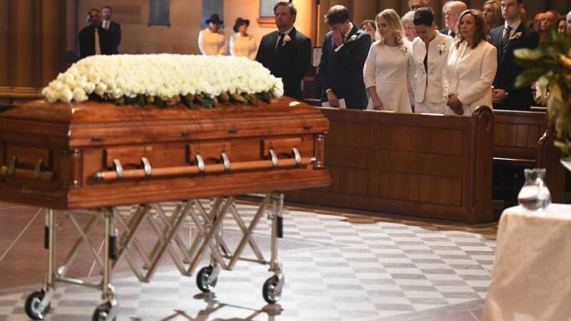 The family of veteran soccer broadcaster Les Murray attend his State Funeral at St. Mary's Cathedral in Sydney. Photo: Dean Lewins
