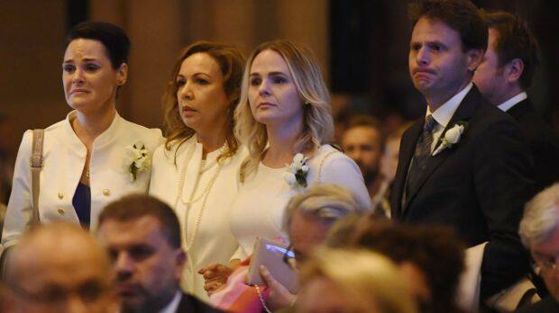 The family of veteran soccer broadcaster Les Murray attend his state funeral at St. Mary's Cathedral in Sydney. Photo: Dean Lewins 