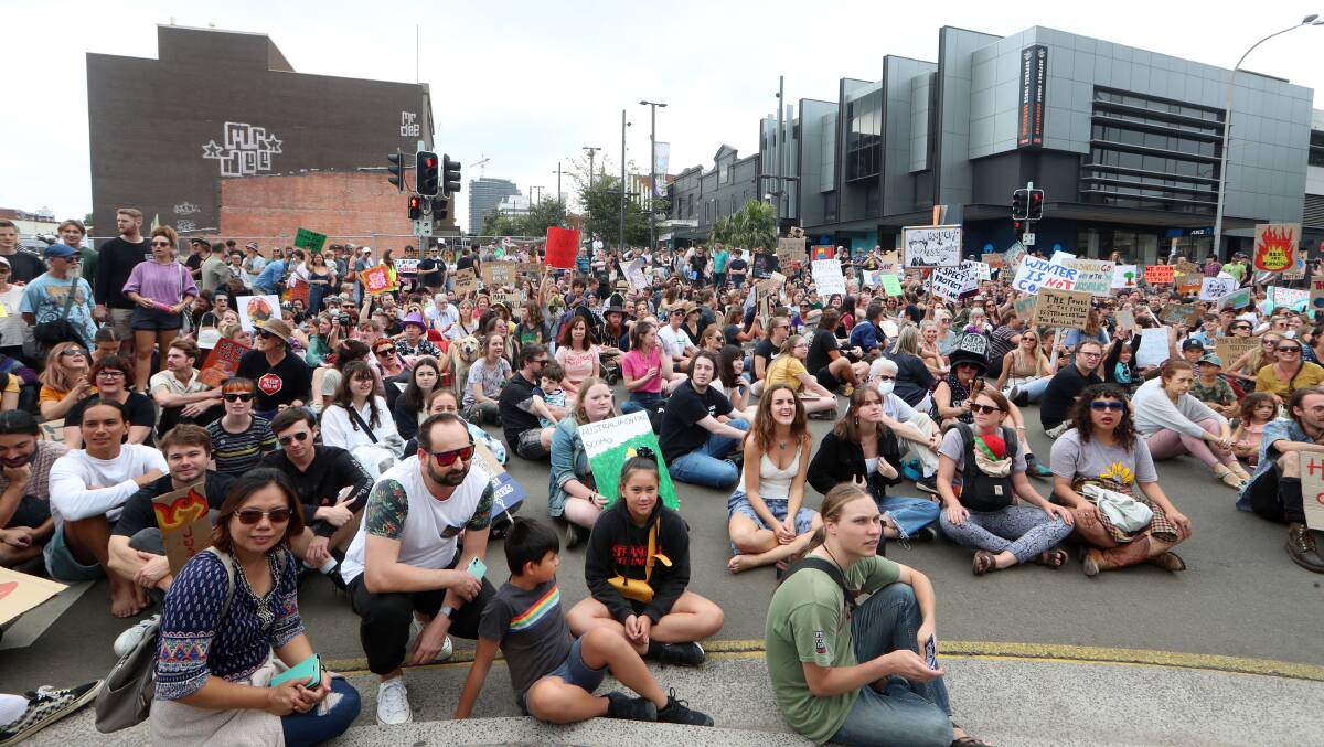 March for change: After the rally which attracted about 2000 people to the arts precinct, protesters marched through Wollongong' CBD. Pictures: Sylvia Liber.