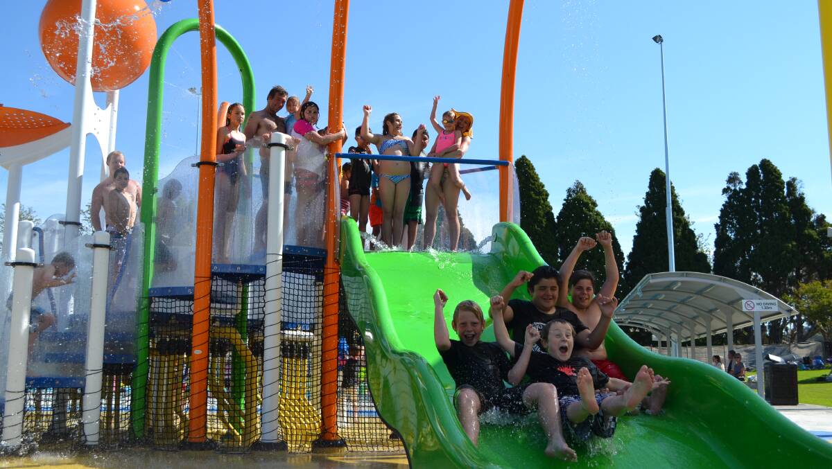 Slip and slide: Nowra Aquatic Park was packed on Saturday for its grand-opening, but the Kid's Play Park was the big winner. Photo: Jessica Long