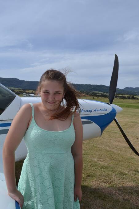 Big dreams: Elyzia Quin, 13, with the Brumby light aircraft at South Coast Recreational Flying Club. Photo: Jessica Long