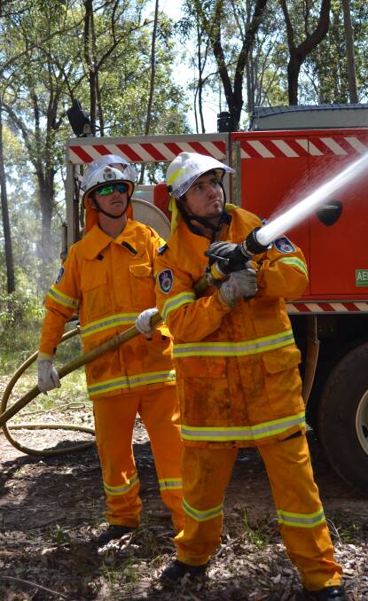 Ready or not: Greenwell Point Rural Fire Brigade firefighters Jason Aivaliotis and Dayle Norris are prepared for bushfires ahead of the peak season. Photo: Jessica Long