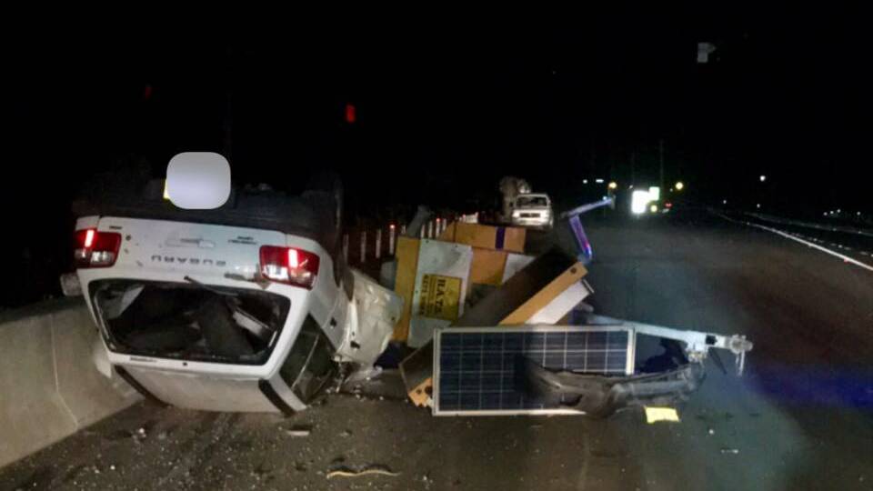 Princes Highway, Berry, where a car rolled and flipped, destroying a mobile message board in the early hours of the morning. Picture: Berry Fire and Rescue