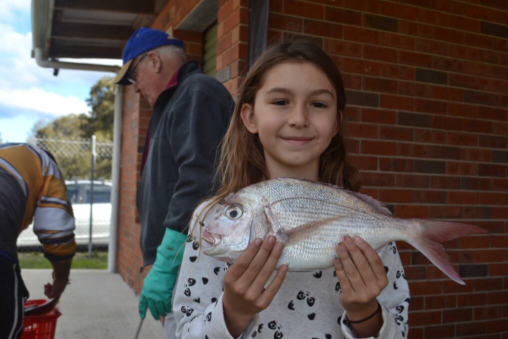 Young angler Jasmine Zorbas, 9, winner of the $2000 prize in the Sussex Inlet Fishing Carnival in 2016, returned for more in 2017, and caught snapper and leather jackets. Picture: Rebecca Fist