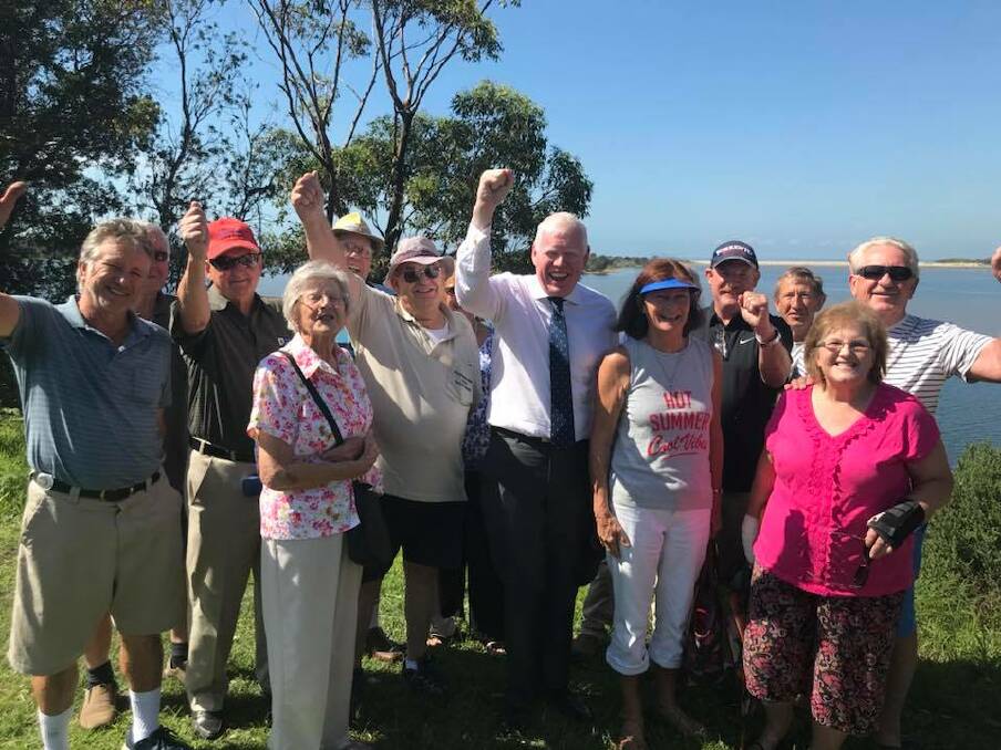 Gareth Ward celebrates the funding with Shoalhaven Heads residents. 