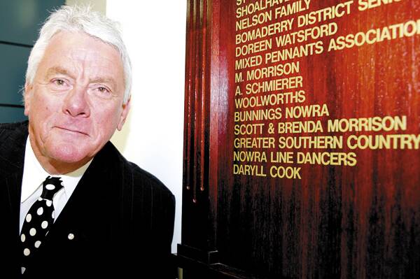 CHAMPION: Daryll Cook in front of the honour board at Shoalhaven Hospital, to which his name was added in 2010