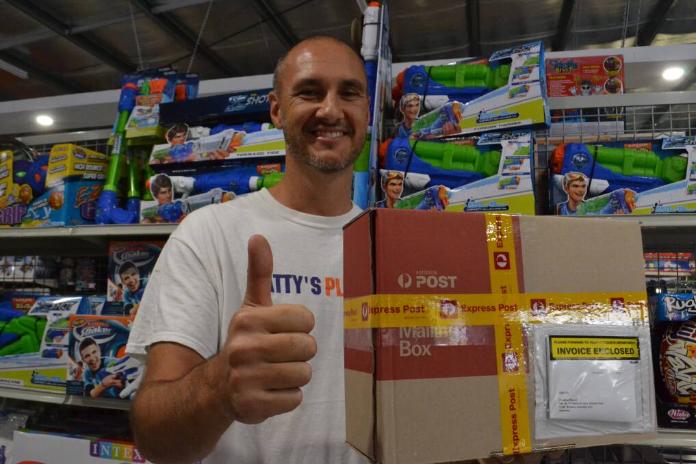 Matt Rose with one of many parcels set for distribution thanks to his business' partnership with Amazon Australia. Picture: Rebecca Fist