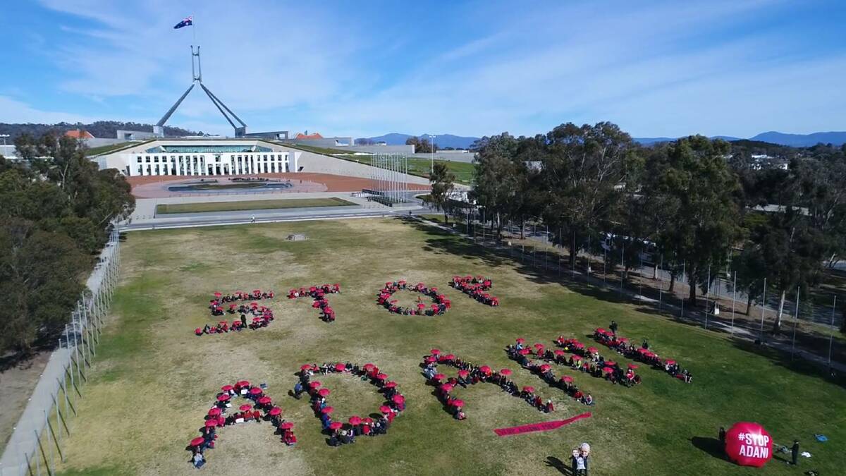 The 'Stop Adani' human sign at Parliament House, Canberra, earlier in the year, where 200 people gathered to protest the development.