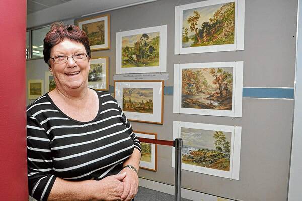 Shoalhaven historian Robyn Florence with part of the historic Samuel Elyard collection on display in the foyer at Shoalhaven City Council in 2011