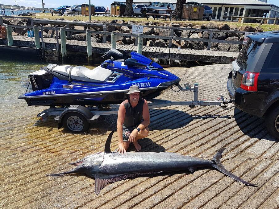 Ryan Field, and the 105kg marlin at the Kiama Harbour boat ramp. 