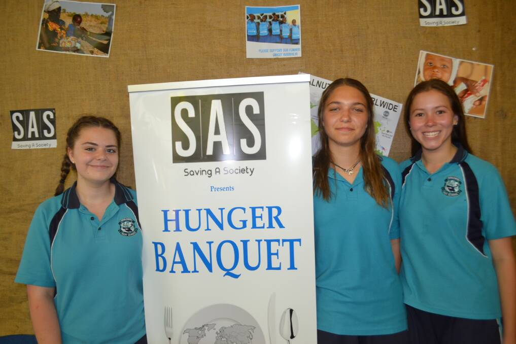 Shoalhaven High School students Skye Wright, Andrea Charalambous and Sophie Dobell conscious of an international problem and doing something about it, appealing to the senses of up to 60 people attending the dinner tonight. Picture: Rebecca Fist