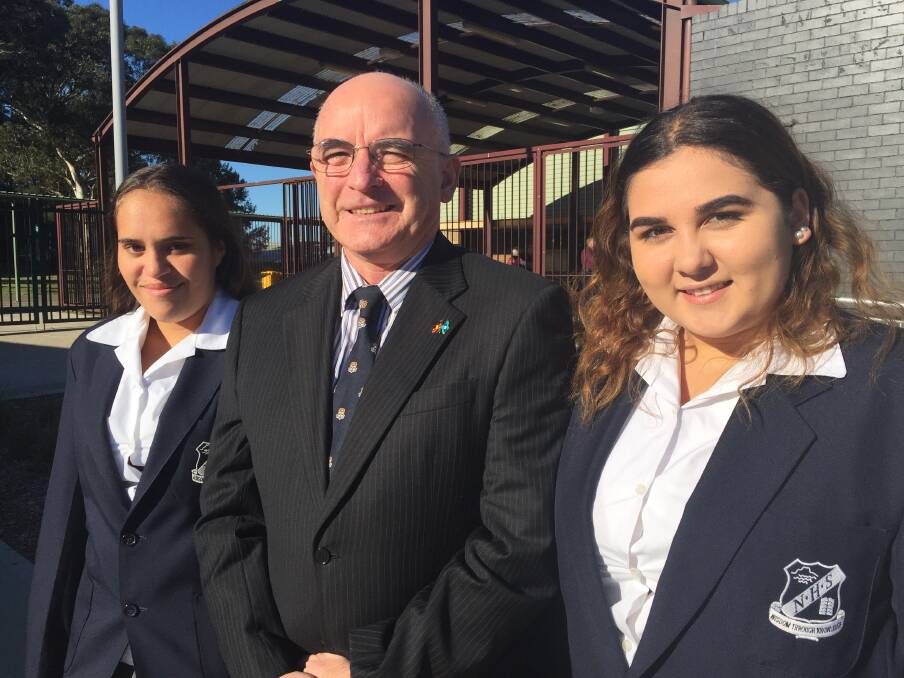 Nekaya Carpenter and Chloe Ashby lead the NAIDOC assembly on Friday, where students also farewell Gerald Buckley (centre). Picture: Rebecca Fist 