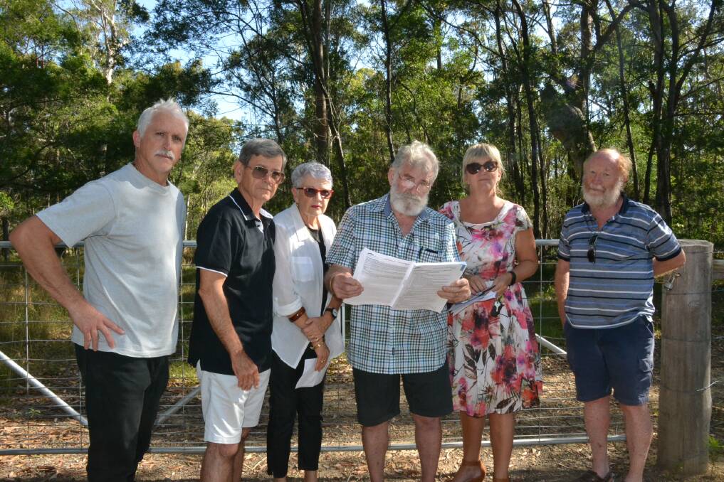 BATTLE LINES: North Nowra residents Peter Button, Wayne and Diane Higginbotham, Dennis Johnson, Jane Bessell-Browne and Bob Death are part of a fighting party opposed to smaller lots in a development planned for their area. Picture: Robert Crawford