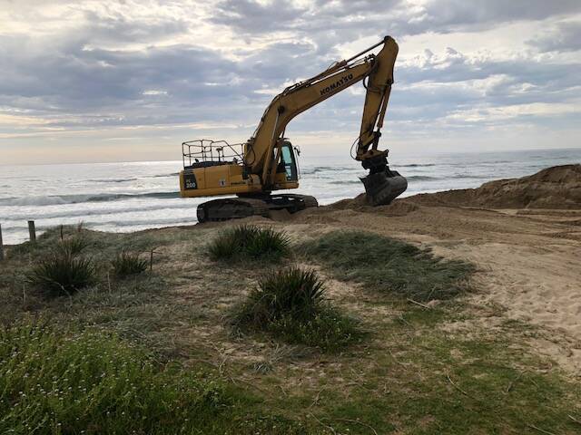 Excavator starts work at Shoalhaven Heads beach on Wednesday. Picture: Graham French