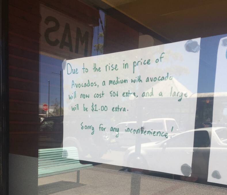 A sign on the window of a Junction Street sushi shop