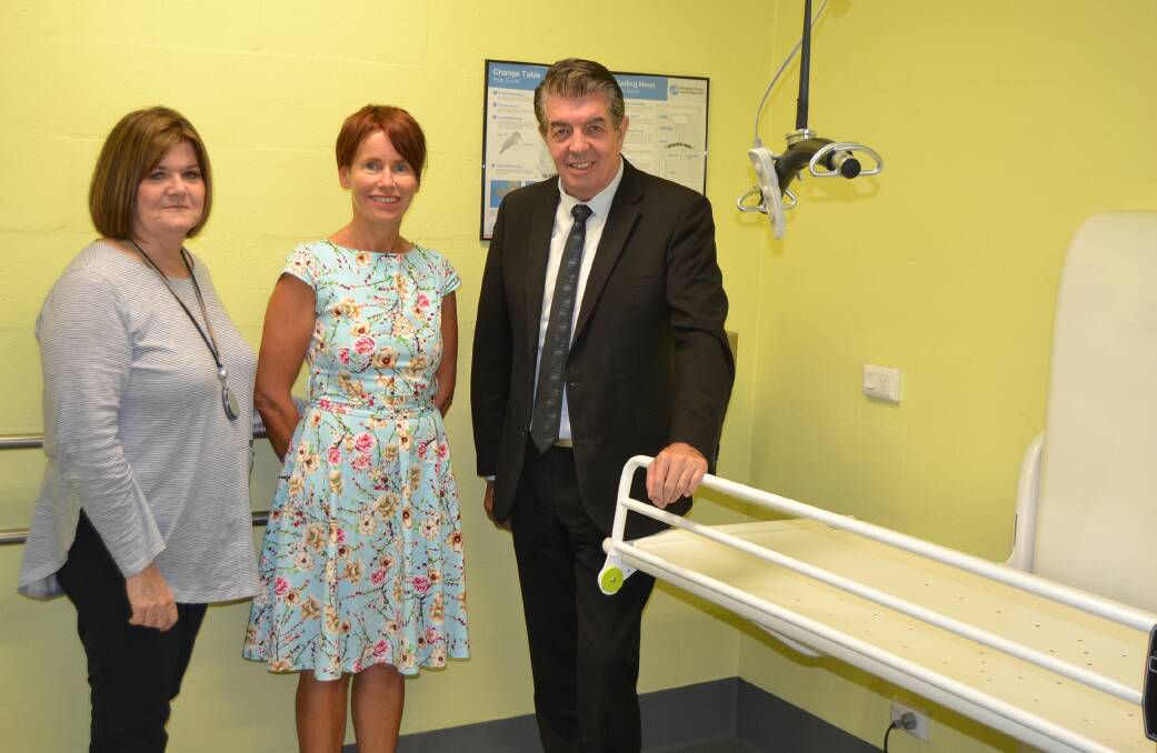 South Coast MP Shelley Hancock, Annette Pham, and NSW minister for disability services Ray Williams inside the Lift and Change facility at Mollymook. 