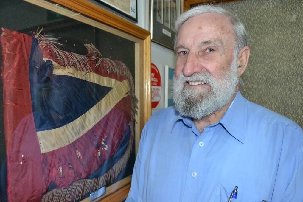TREASURE: Nowra RSL Sub-Branch president Fred Dawson with one of the organisation’s superb pieces of military memorabilia, a Union Jack from the Boer War.