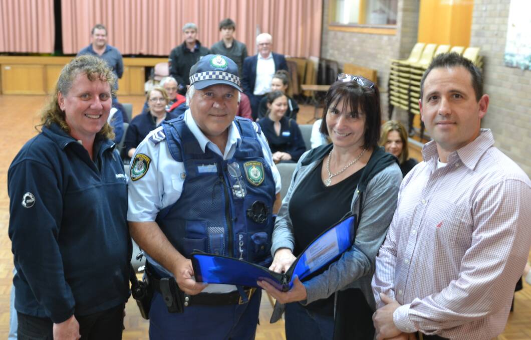 GOOD OIL: Shoalhaven Local Area Command crime prevention officer Senior Constable Anthony Jory chats to local shop owners Elvy Hill, Annie Aldous and George Parker at the crime prevention and safety meeting.