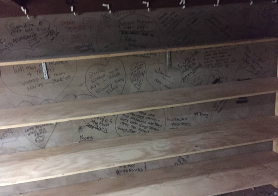 MEMORIES: Signatures of former employees who worked at the Spotlight building underneath the beautiful wooden staircase that joins the ground and lower ground floors.
