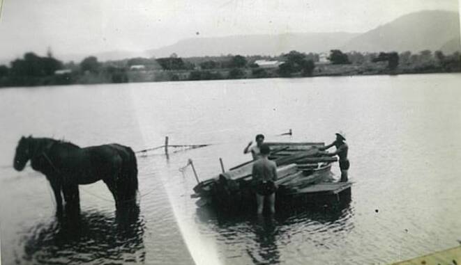 Keith and Sid Tarman and George Smith getting supplies onto Pig Island in 1947.