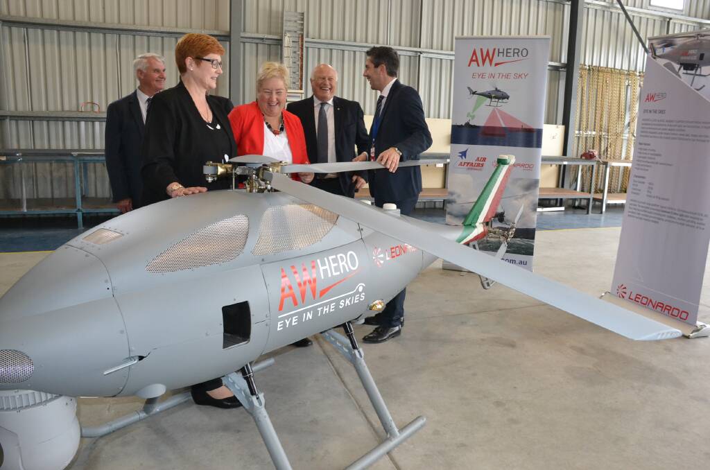 Minister for Defence Senator Marise Payne and Gilmore MP Ann Sudmalis look over the AgustaWestland Hero unmanned helicopter at Air Affairs at the Aviation Technology Park.