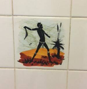 A photograph supplied by ACT Labor politician Bec Cody showing one of the tiles in the men's urinal at the Sussex Inlet RSL, which she says is a disgrace. Photo: Supplied