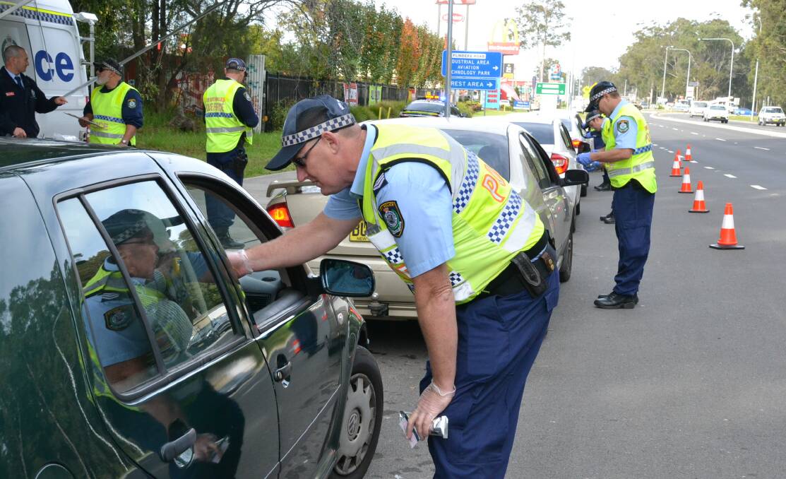 TESTING TIMES: Shoalhaven police officers conduct a random roadside drug test at South Nowra.