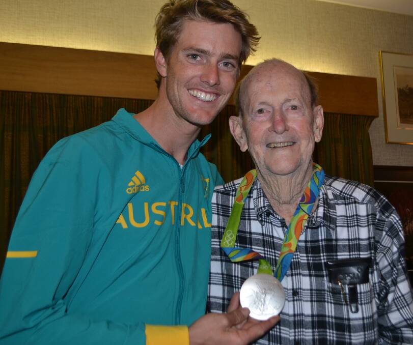 Proud grandfather Dr Bill Ryan with his grandson Will who claimed a silver medal at the 2016 Rio Olympics in sailing.