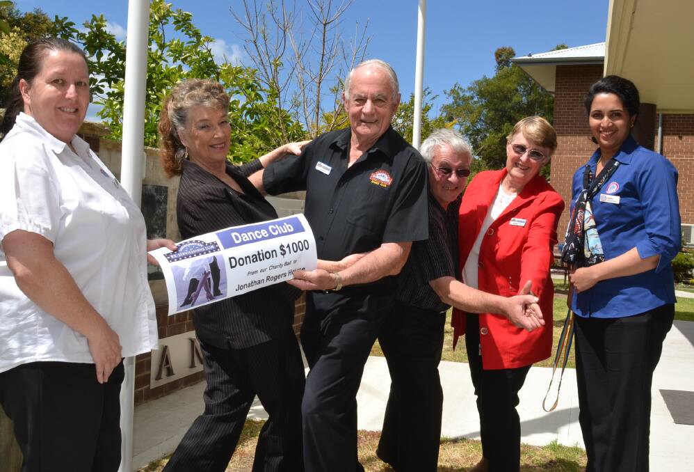 READY TO ROCK: Shoalhaven Ex-Servicemen’s Club Dance Club members John and Jan Bailey and Michael and Annette Mack present their donation to Jonathan Rogers House acting lifestyle manager Leanne Moon and acting care manager Sabitha Andrews.