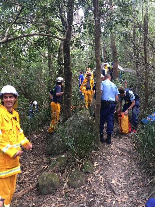 Emergency services combined to rescue an 74-year-old man from who had fallen 15 metres over the side of the Drawing Room Rocks walking track. Photo: Shoalhaven Heads Rural Fire Service
