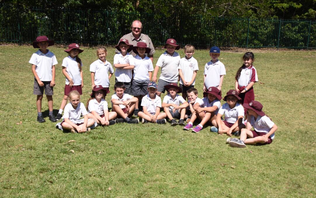 MYSTERY SOLVED? Nowra Public year 2 students, 2M with teacher Shane McMillan, on their playing oval where they believe the mysterious well described in Hayley Warden’s historical article in the South Coast Register is located.
