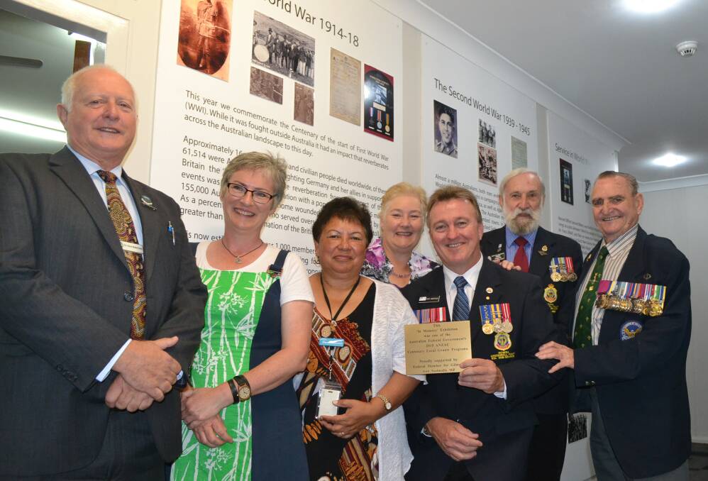DEDICATION: The In memory Exhibition was given a permanent home on Wednesday at the Nowra RSL Sub-Branch Hall. At the dedication were Shoalhaven Councillors Clive Robertson and  Amanda Findley, Shoalhaven Council Aboriginal Community Development Officer Margaret Simoes, Gilmore MP Ann Sudmalis, Nowra RSL secretary Rick Meehan, president Fred Dawson and Keith Payne VC.