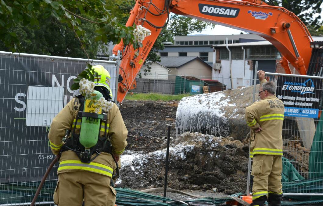 SAFETY: Fire and Rescue NSW Nowra and Shoalhaven crews sprayed foam over the tanks discovered in Graham Street, Nowra to suppress fumes.