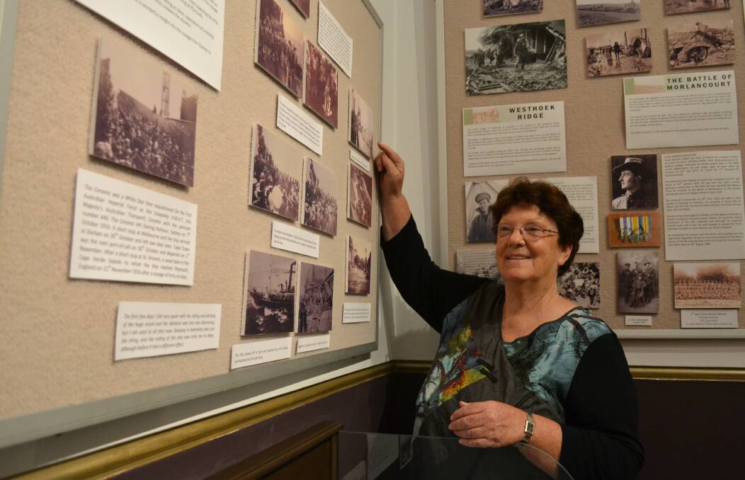 ON SHOW: Shoalhaven Historical Society historian and life member Robyn Florance with the Not Forgotten exhibition at the Nowra Museum.
