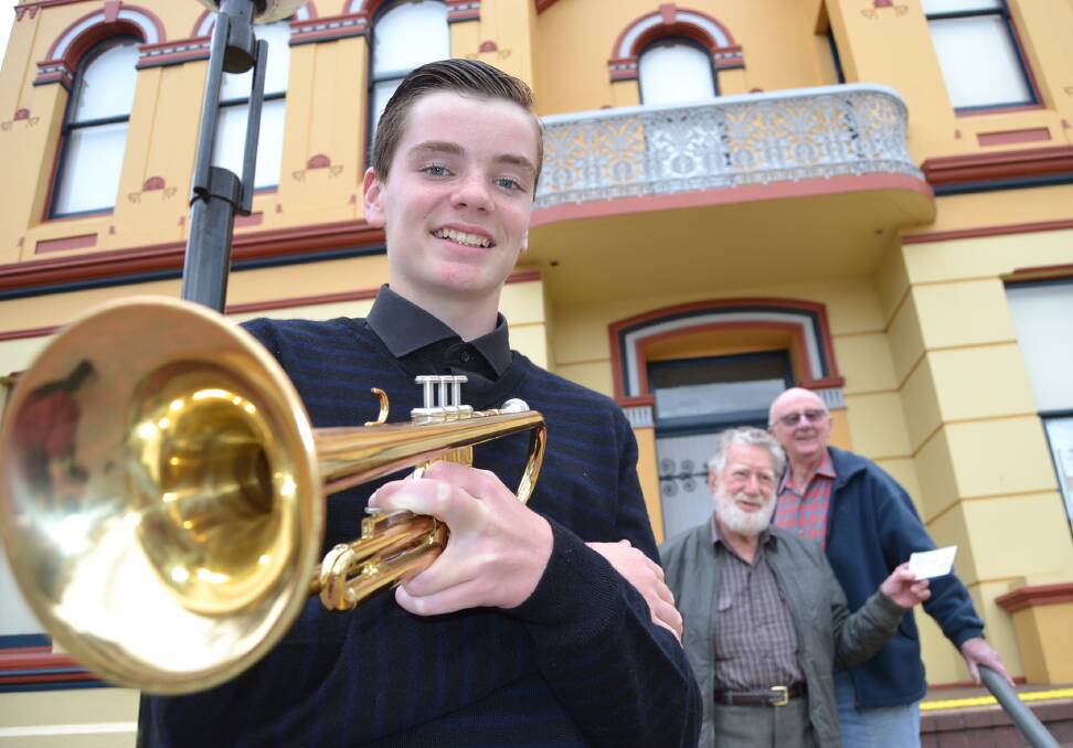 YOUNG TALENT: Harrison Graham took out the patron’s award at this year’s Shoalhaven City Eisteddfod and received his prize from eisteddfod president George Windsor and patron Max Croot.