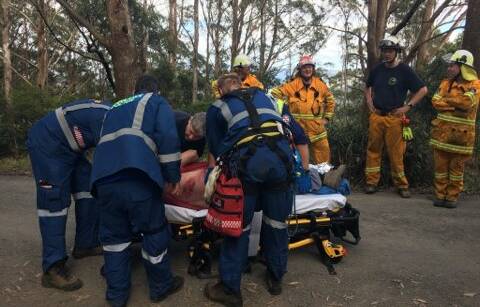 NSW Ambulance paramedics work to stabilise the injured man before he was transported to Wollongong Hospital.