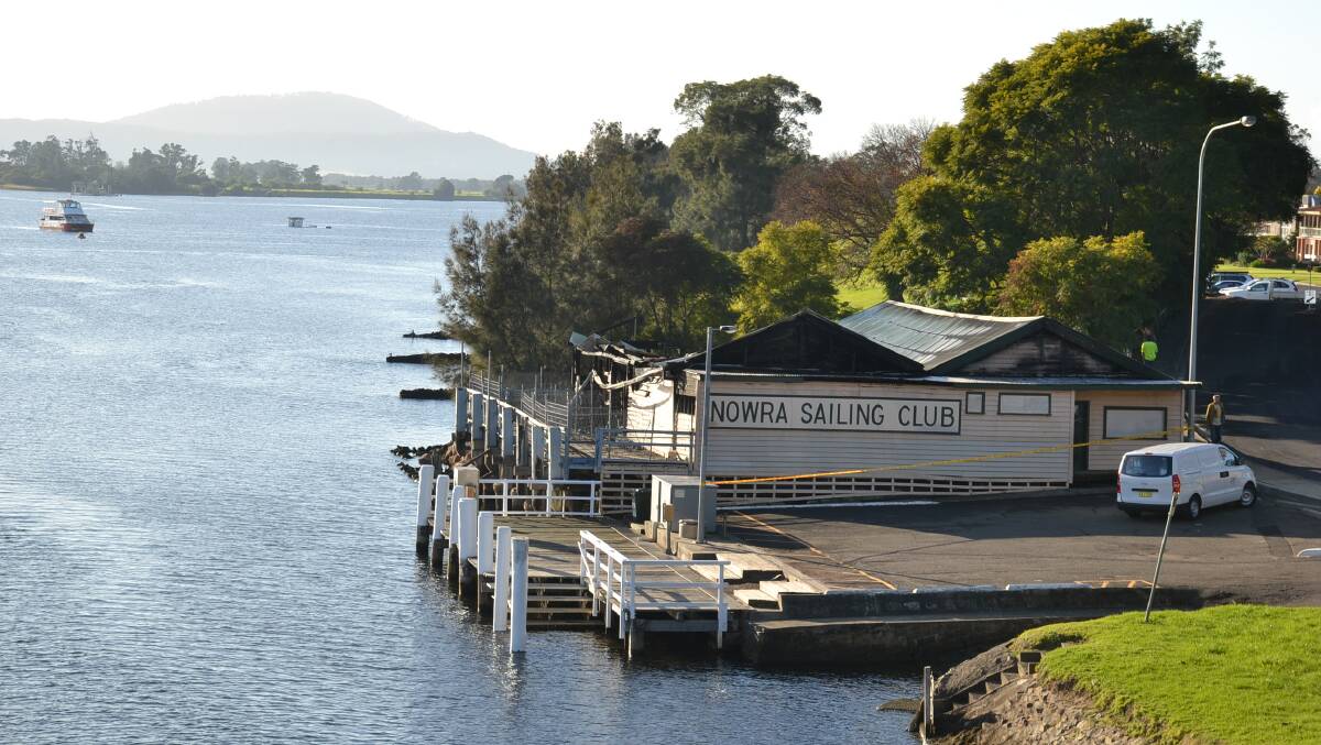 The damaged Nowra Sailing Club from the Shoalhaven River bridge.

