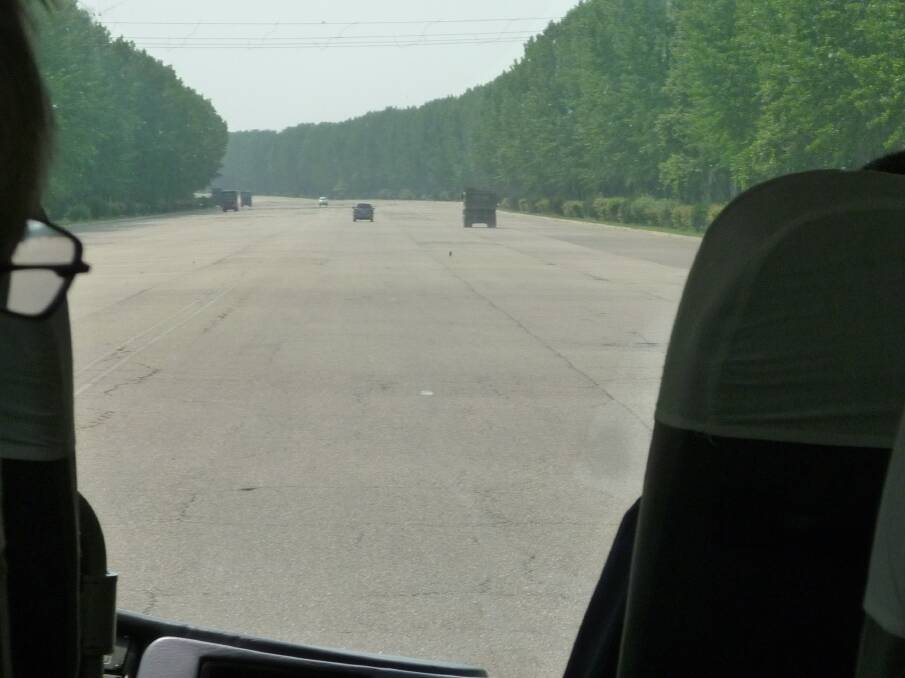 One of the expansive North Korean highways, 14 lanes wide, which virtually has no traffic.