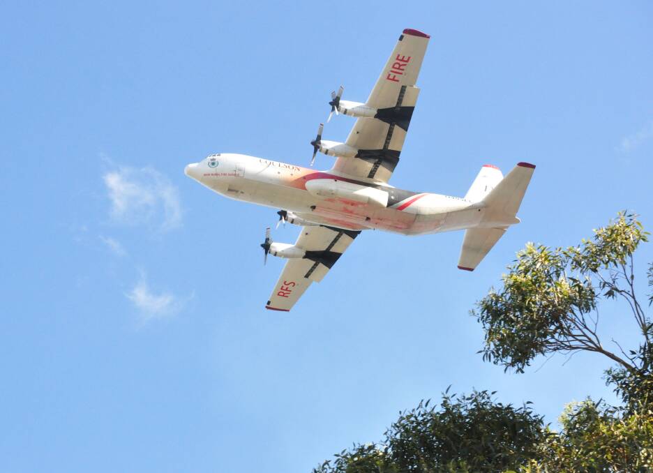 The Rural Fire Service C130 Hercules water bombing aircraft, Thor, during the September fires in West Nowra.