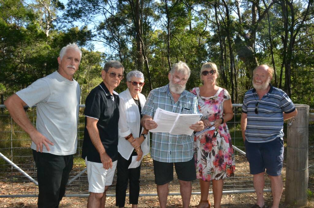 BATTLE LINES: North Nowra residents Peter Button, Wayne and Diane Higginbotham, Dennis Johnson, Jane Bessell-Browne and Bob Death are part of a fighting party opposed to a 400-lot housing development in their area.