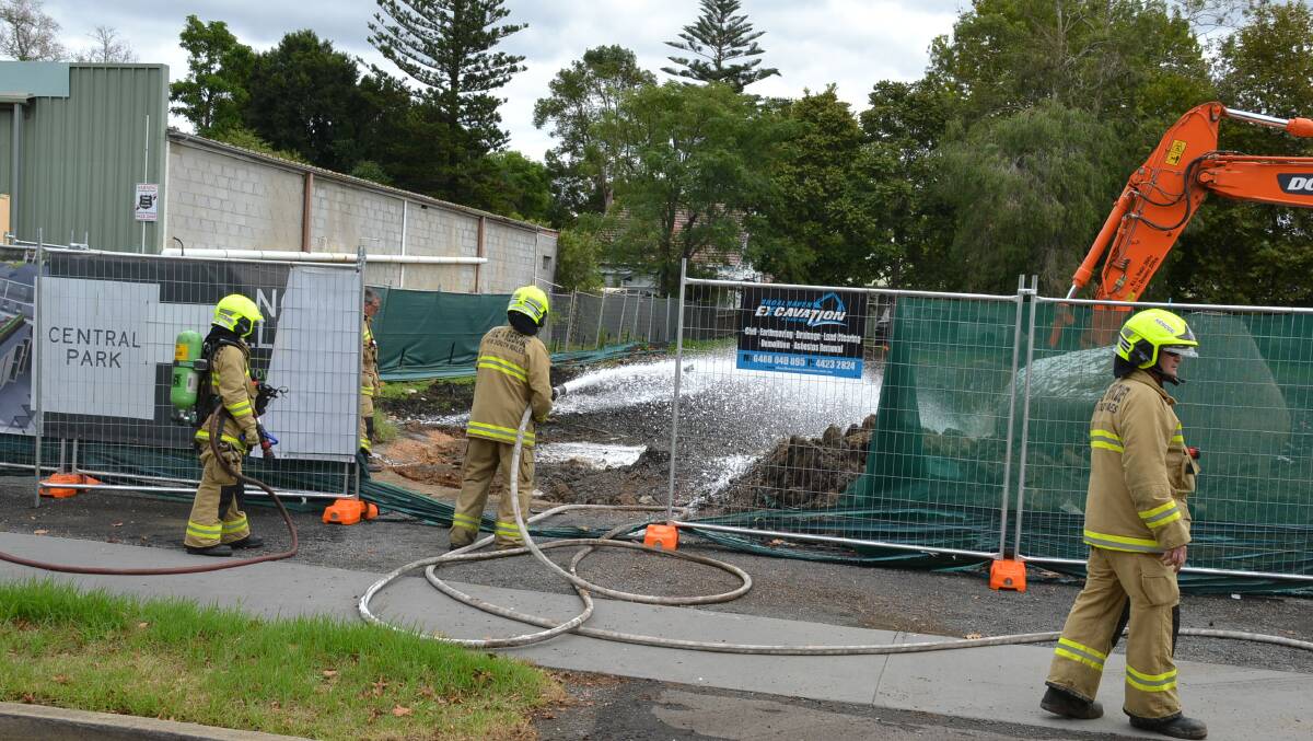 Fire and Rescue NSW crews spray foam over the area in Graham Street to suppress the fumes.
