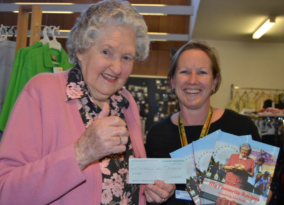 HUGE EFFORT: Champion Shoalhaven cook Voni Muller sold out 750 copies of her first book, My Favourite Recipes, forcing a reprint. She presented a cheque for $2000 to St Vincent de Paul Society centre supervisor Tina Hill.