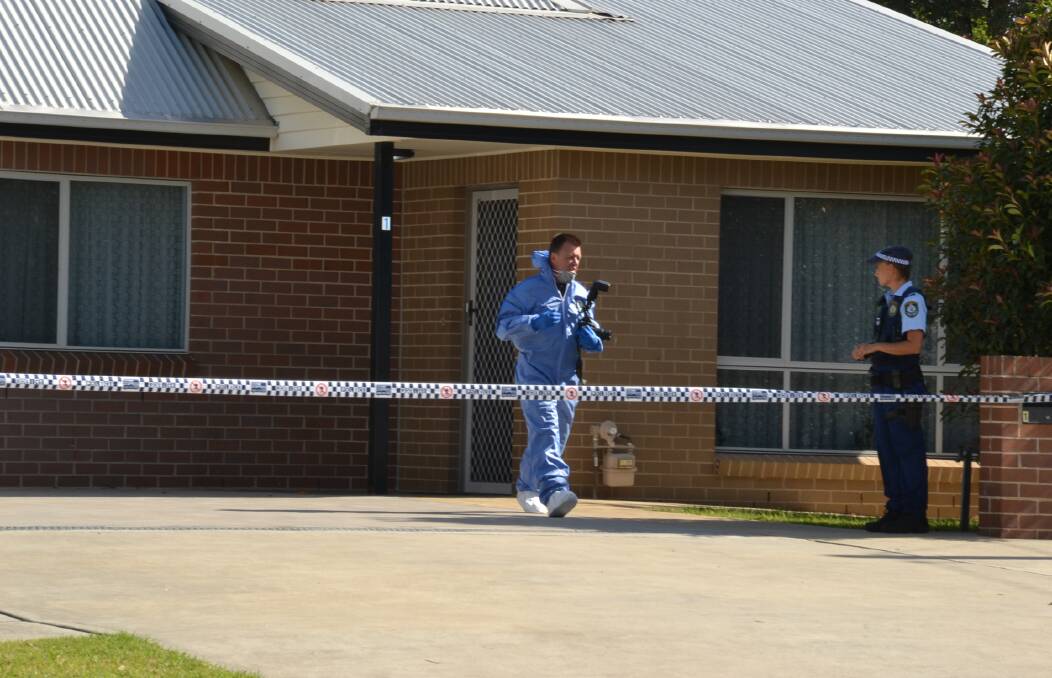 Investigation: A scientific officer leaves the Nowra home.