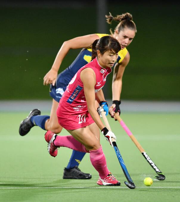 POSSESSION: Gerringong's Grace Stewart battles for possession with Japan's Minami Shimizu during the Hockeyroos 2-1 victory and series win at the State Hockey Centre, Gepps Cross, Adelaide. Photo: AAP Image/David Mariuz
