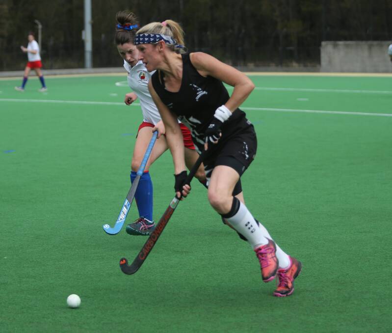  THE FLY: Berry's Suzi Jarman takes on the Burrawang defence. Photo: Robert Crawford