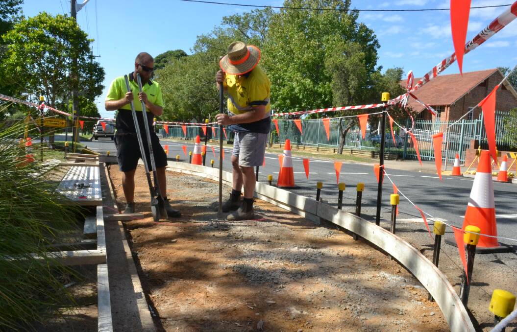 Work has started on the raised pedestrian crossing outside St Michael’s Catholic School in North Street, Nowra. Council Assets and Works team members Liam Payne and Steve Waldron work on the new structure.